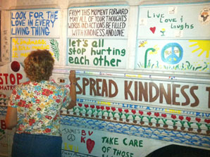 Joan Marie painting kindness bus